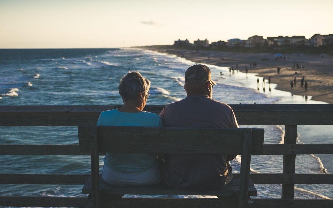 Elderly Couple sitting at a bench, Tax Advisors